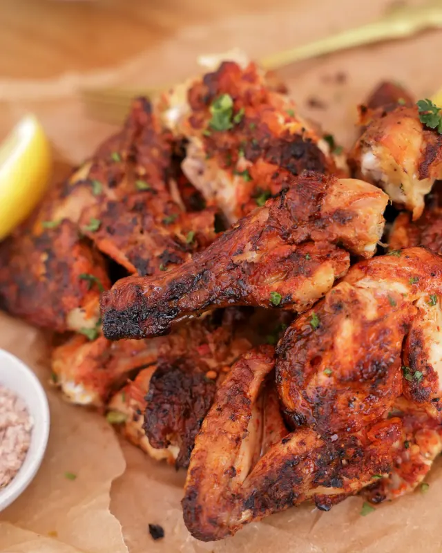 Platter of grilled Portuguese chicken pieces - Parreirinha Rapido Illovo